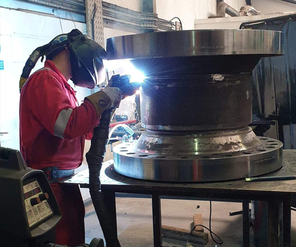 TPMG Welder working on engineering component